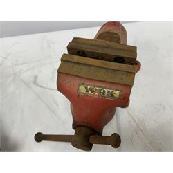 Red table top vice and a Wood Milne motor tyres Hutton's patent foot pump