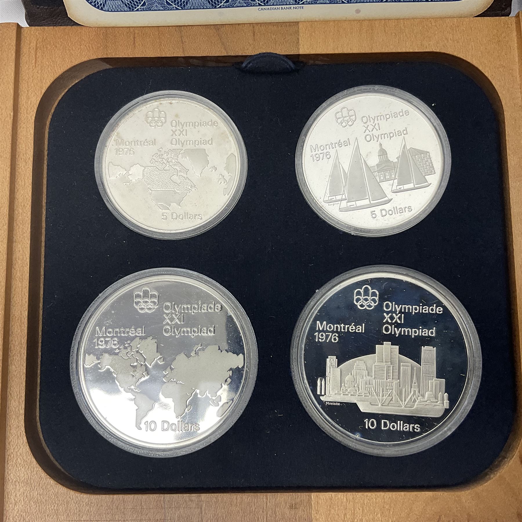 Six Queen Elizabeth II The Royal Canadian Mint silver proof four coin sets, to commemorate the 1976 Montreal Olympic Games, each set containing two five dollar coins and two ten dollar coin with Queen's head obverse and designs to the reverse relating to the Olympic Games, all in the original display cases and outer card boxes with certificates