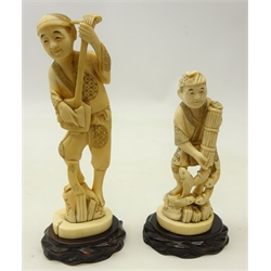  Two Meiji period Japanese ivory Okimonos, each carved as one piece, depicting a travelling musician playing the Shamisen with a Bachi, H14.5cm and a fisherman with his catch, both on ivory bases & hardwood plinths with signatures to base (2)  