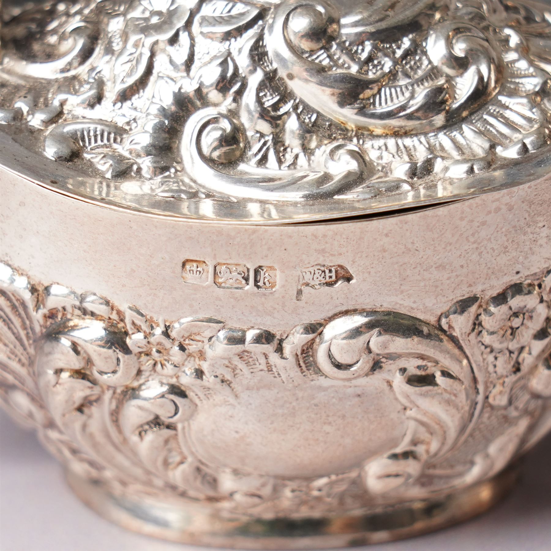 Victorian Scottish silver toddy ladle, the bowl inset with a Victorian shilling coin and with twisted whale bone handle Glasgow 1850 Maker Blaikley & Good, embossed silver drum mustard pot and and an oval mustard pot Sheffield 1902 (3)