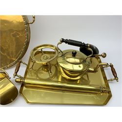 A group of brass and copper, to include brass spirit kettle, brass tray with bamboo modelled gallery, brass rolling pin, copper measure, Picquot ware kettle, etc. 