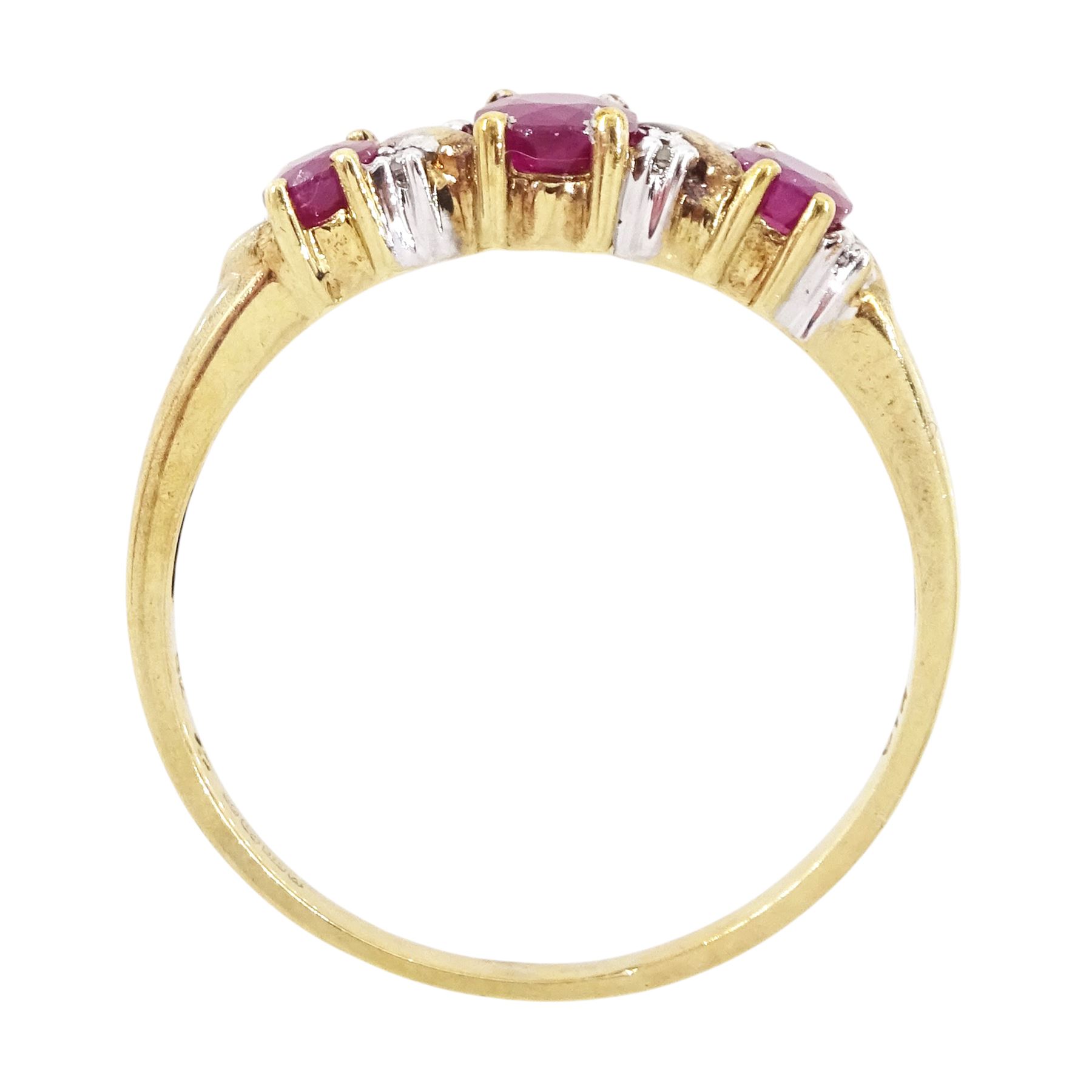 9ct gold ruby and diamond ring, three oval cut rubies spaced by six accent diamonds, stamped 9k