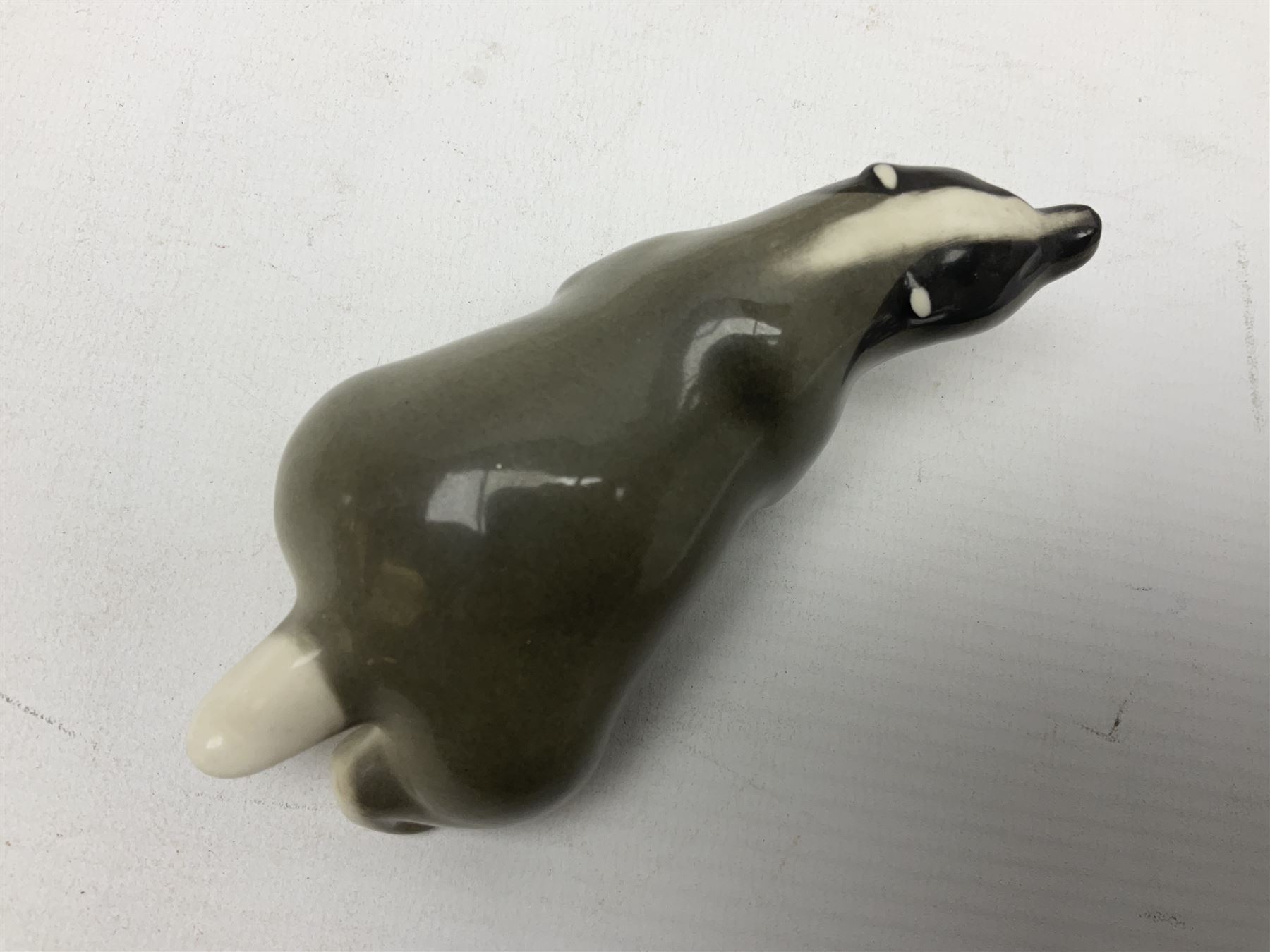 1970's Hornsea mugs, comprising Train Robber pattern designed by John Clappison and Owl from the ‘Newsprint’ Zoo range designed by Jack Dadd, and three USSR figures of animals comprising raccoon, ferret and badger