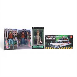 Neca Back to the Future Marty Mcfly figure, AMT Ghostbusters Ecto-1A 1:25 scale model kit and Vinyl Idolz Egon Spengler figure, all boxed