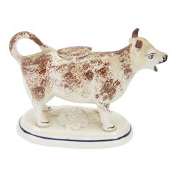 Collection of 19th century and later cow creamers, including three black glaze examples, two mottled brown examples etc  