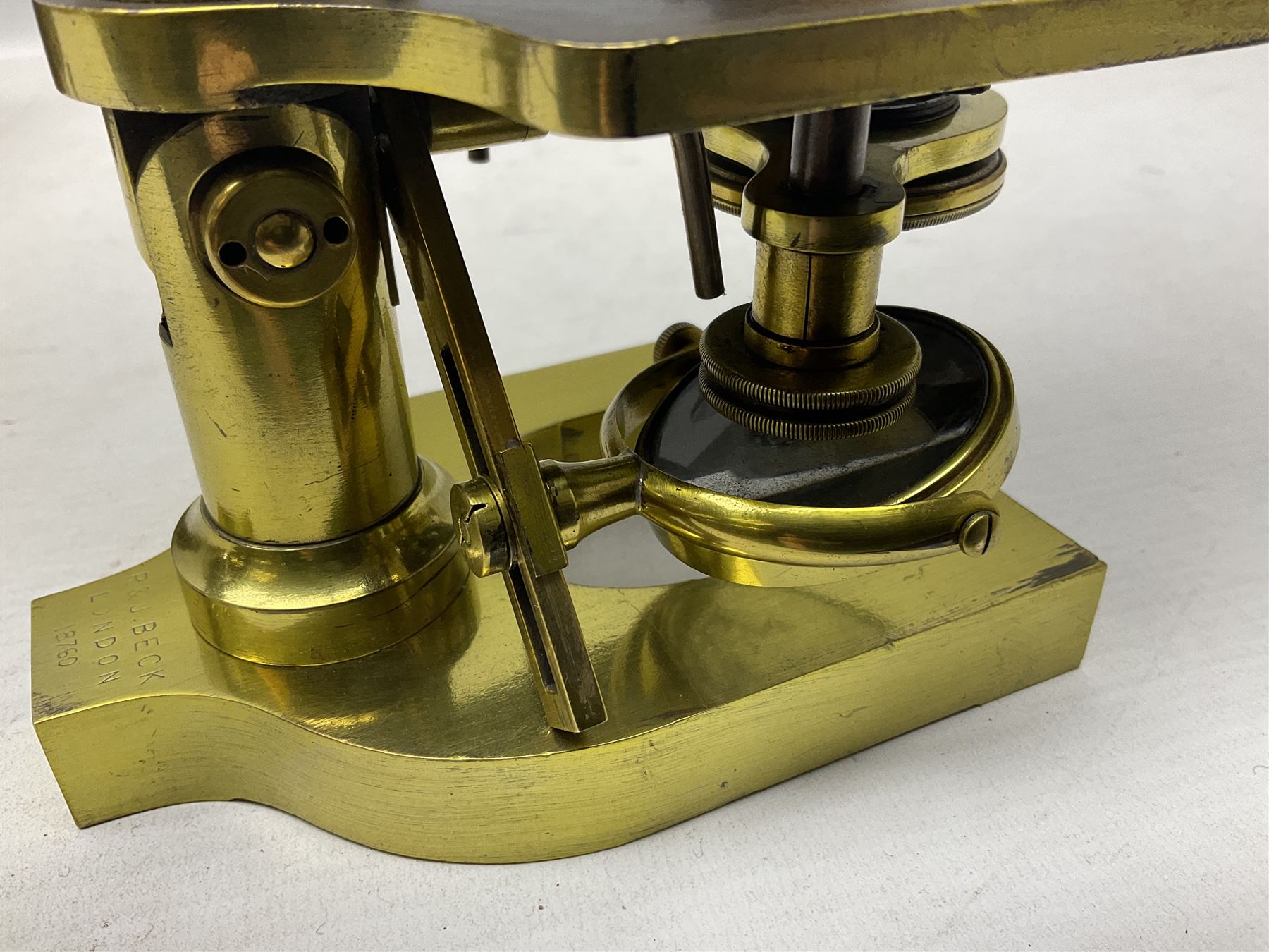 19th century brass monocular microscope by R. & J. Beck London No.18760 with hinged column and pitchfork base H25cm; in fitted mahogany case with two lenses