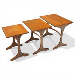 Victor Wilkins for G-Plan - 1970s teak 'Fresco' nest of three tables, rectangular top over vasiform end-supports with sledge feet, united by curved stretchers