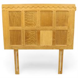 Mouseman - single bed oak headboard, comprising eight vertical fielded panels beneath a shaped and scalloped top rail, carved with the signature mouse motif, by the workshop of Robert Thompson, Kilburn 