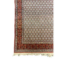 Fine Persian beige and red ground rug