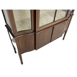 Edwardian inlaid mahogany display cabinet, serpentine break-front, single astragal glazed door above two cupboards