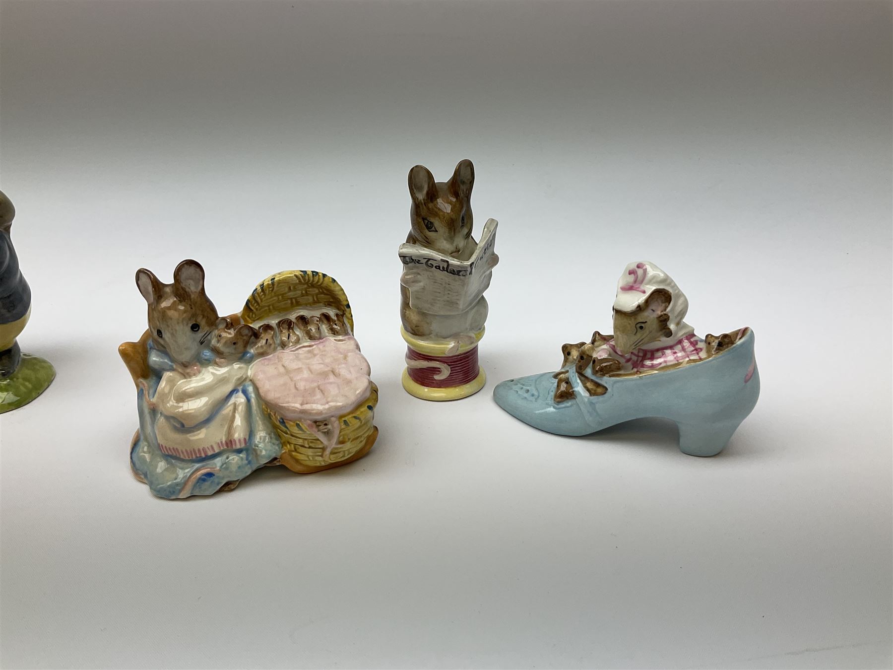 Fifteen Beswick Beatrix Potter figures, comprising Tommy Brock, The Old Woman who live in a Shoe, Samuel Whiskers, Foxy Whiskered Gentleman, Old Mr Brown, Mr Benjamin Bunny and Peter Rabbit, Tailor of Gloucester, Goody Tiptoes, Mr Benjamin Bunny, Diggory Diggory Delvet, Jemima Puddleduck, Aunt Pettitoes, Hunca Munca, Rebeccah Puddle-Duck, and Lady Mouse. 