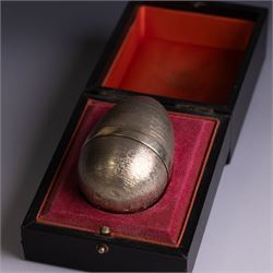 Stuart Devlin - Late 20th century silver and silver-gilt surprise egg, the textured gilt exterior opening to reveal an underwater scene with two fish and an anchor, hallmarked Stuart Devlin, London 1977, boxed, H10cm
