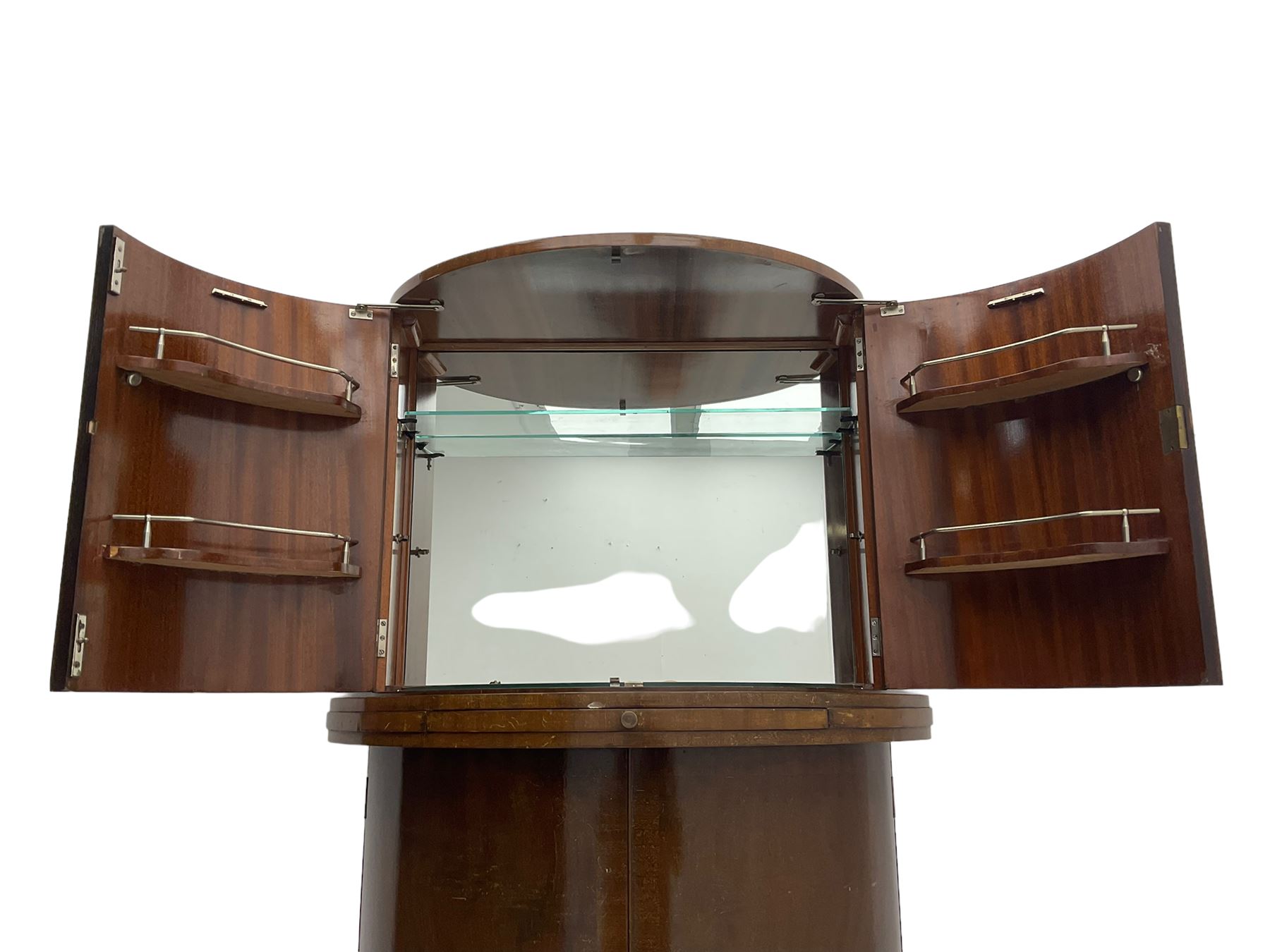 1930s Art Deco walnut demi-lune cocktail cabinet, enclosed by four curved doors, the upper section with mirrored interior, glass shelf and glass holders, the lower section fitted with shelves and bottle holders