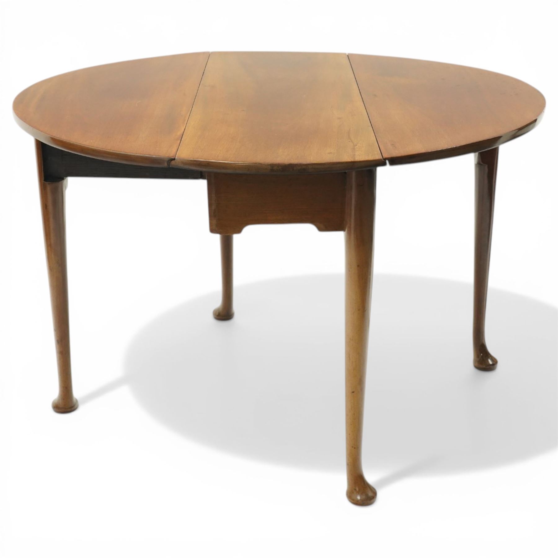 Mid 18th century mahogany pad foot drop leaf table, the circular top with gate leg action, freshly polished throughout
