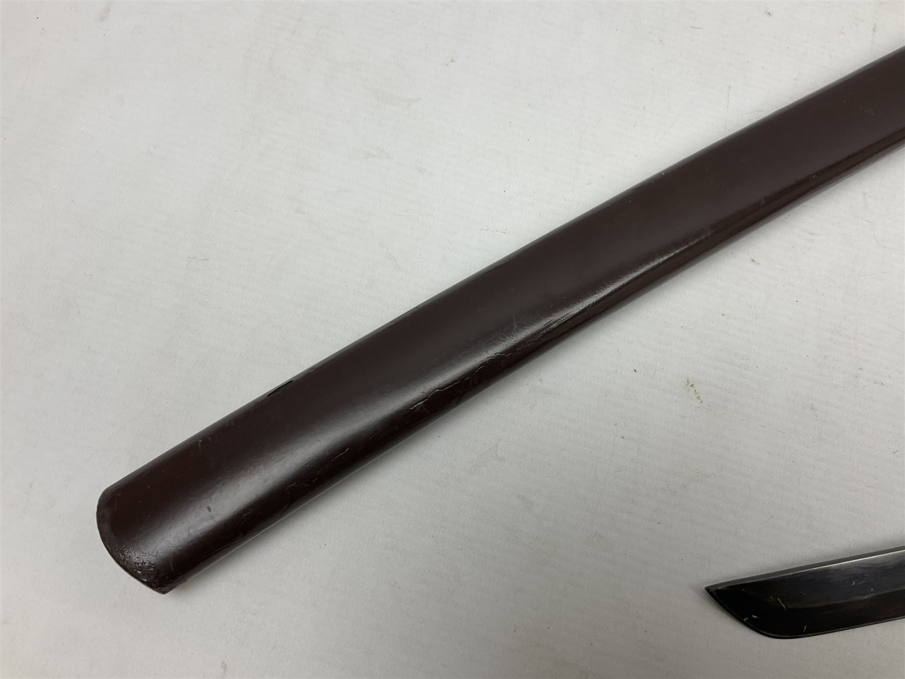 Reproduction Scottish officers basket hilt broad sword, the brass basket pierced with heart-shaped motifs lined with red lining, together with a reproduction Japanese Katana sword, longest L110cm