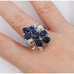 Oval cut sapphire and diamond cluster ring