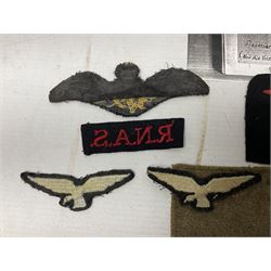 WW1 British Army Derby Scheme 1915 Attested armband; beret with East Yorkshire cap badge; pair of fur lined leather flying/motorcycle goggles; HMS Pembroke cap band; and small quantity of RNAS cloth and metal badges etc