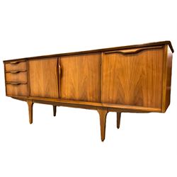 Jentique - mid-20th century teak sideboard, fitted with three drawers, double cupboard and fall front cupboard, raised on tapering supports